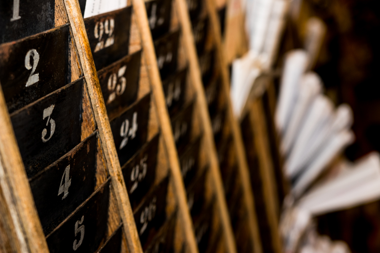 Close-up of a wooden shelf with numbers

Description automatically generated